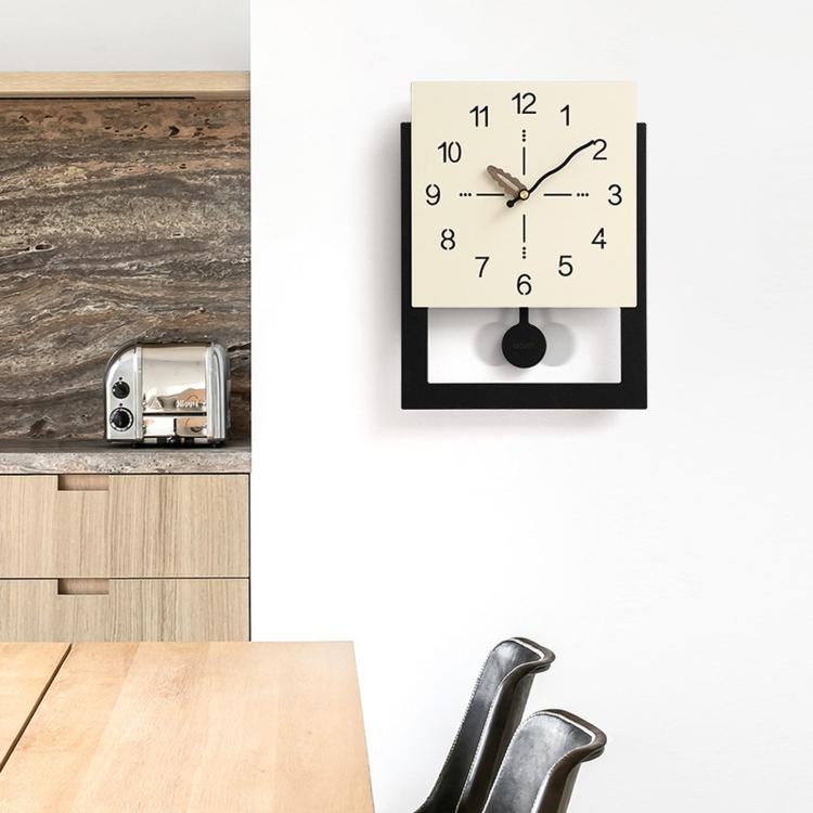 Cream white wall clock with minimalist dial and dark mount, includes hanging disc