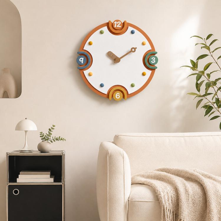 Modern wall clock with orange rim, cream dial, colorful numbers, and metal hands