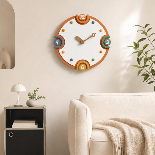 Modern wall clock with orange rim, cream dial, colorful numbers, and metal hands