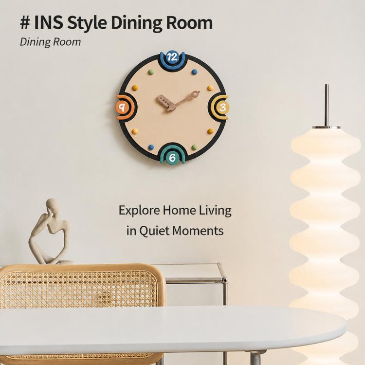 Modern orange-rim wall clock with cream dial and colorful numbered markers, metal hands