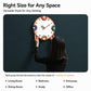 Modern wall clock with orange rim, cream dial, colorful numbers, held by a person