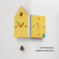 Yellow double-faced corner wall clock, house shape with metal knob and colored time markers
