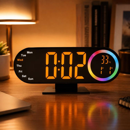 RGB mirror alarm clock showing orange LED time with rainbow-edged temperature dial