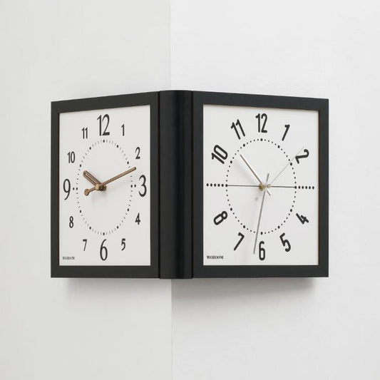 Corner double-sided wall clock with light wood faces, brown hands, black frame