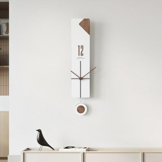 White minimalist wall clock with cross-line dial, slim hands, and round pendulum weight