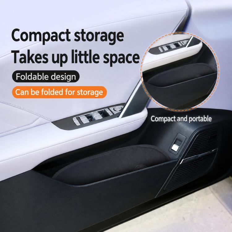 Folded black car sunshade stored compactly inside the car near the seat