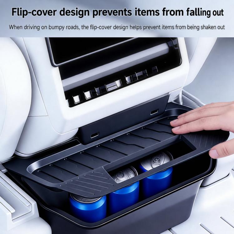 Rear seat storage box with flip cover open, holding items in molded black compartment