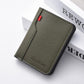 Men's vertical bi-fold billfold wallet in green with red accent and stitched border