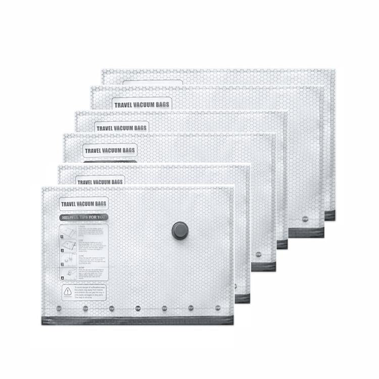 Clear vacuum compression bags set with round valve caps, stacked for household clothing storage