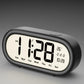 Black digital alarm clock with large time, date, and temperature display icons