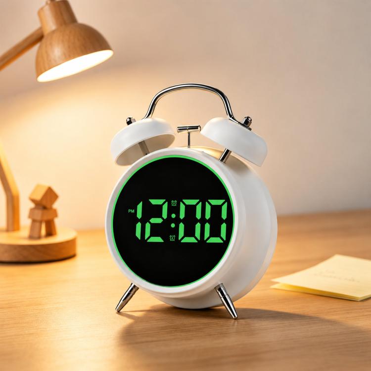 White twin-bell digital alarm clock with green glowing ring and green LED time display