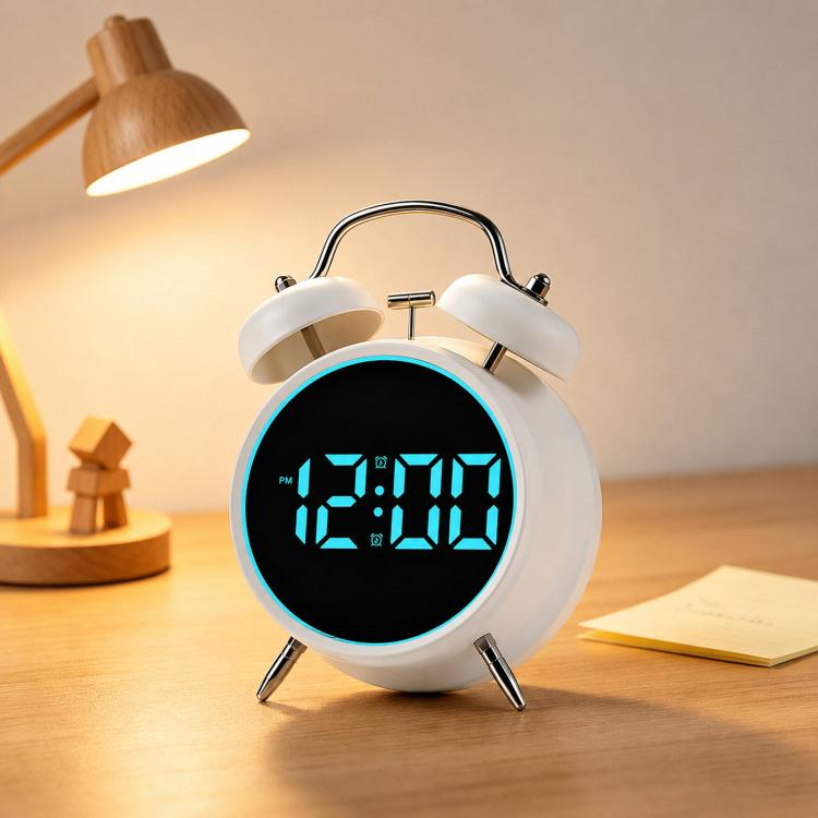 White twin-bell digital alarm clock with blue glowing ring and blue LED time display