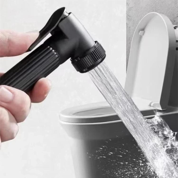 Handheld black toilet sprayer releasing a water stream into bowl