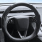 Black steering wheel cover with textured grip and stitched rim