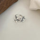 Sterling silver adjustable open ring with two daisy flower charms