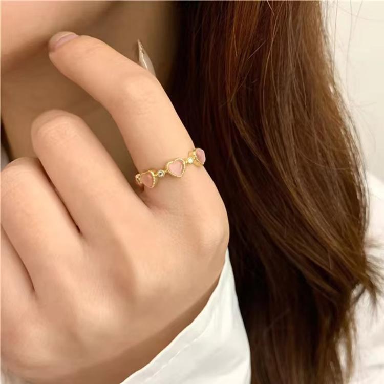 Adjustable heart ring with pink cat-eye stones and gold-tone cubic zirconia accents