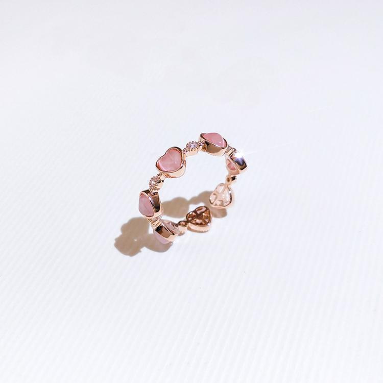 Gold-tone adjustable heart ring with pink cat-eye and heart crystal details