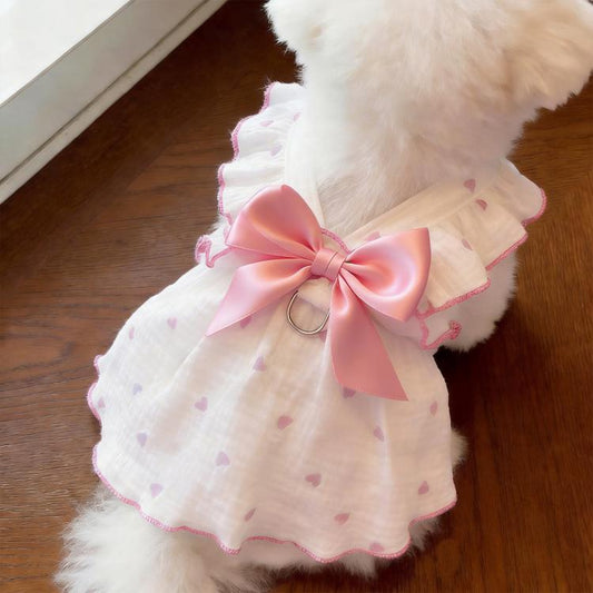 Cat harness dress in white with pink satin bow at chest, heart dot pattern, ruffle hem