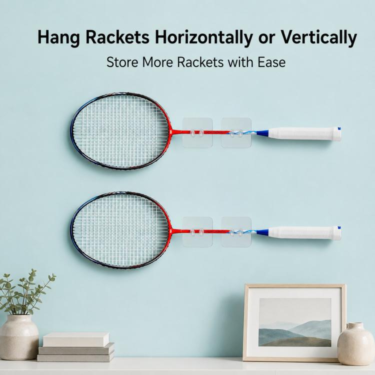 Two badminton rackets hanging from adhesive wall hooks, supports horizontal storage