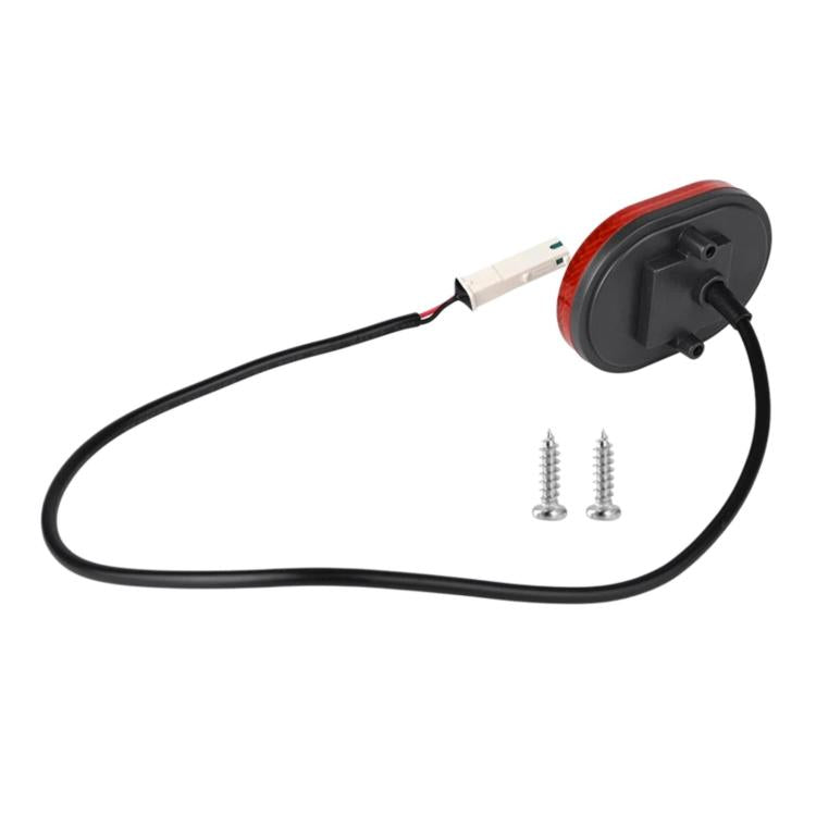 Red rear tail light with black cable and white connector plug, plus two screws