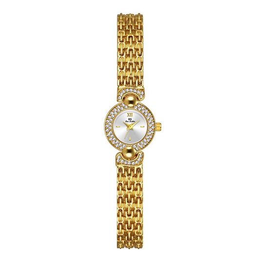 Gold bracelet watch with small round dial, rhinestone bezel, and ornate crown charm.