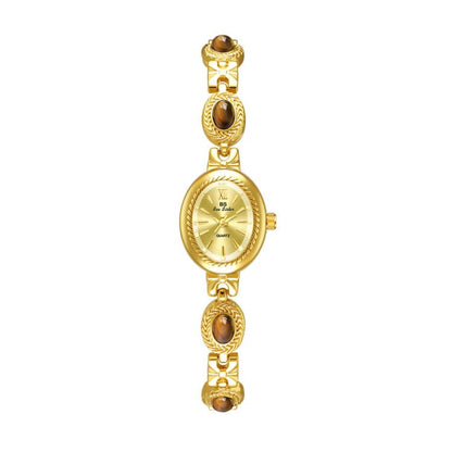 Gold oval analog quartz bracelet watch with brown stone bezel links