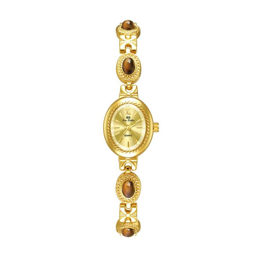Gold oval analog quartz bracelet watch with brown stone bezel links