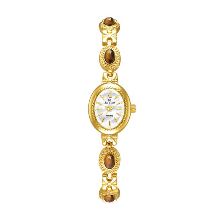 Gold oval analog quartz watch with brown stones and chain bracelet