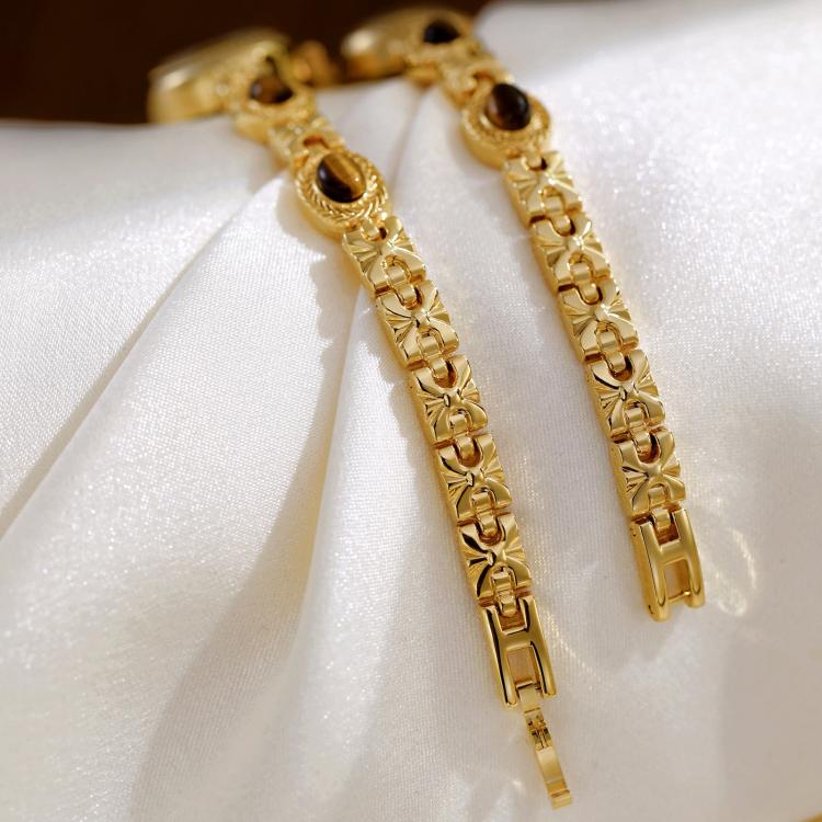 Gold metal chain bracelet with oval stone bezel watch links