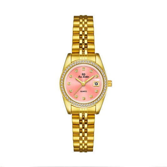 Gold-tone analog wristwatch with pink dial, rhinestone bezel, and metal link bracelet