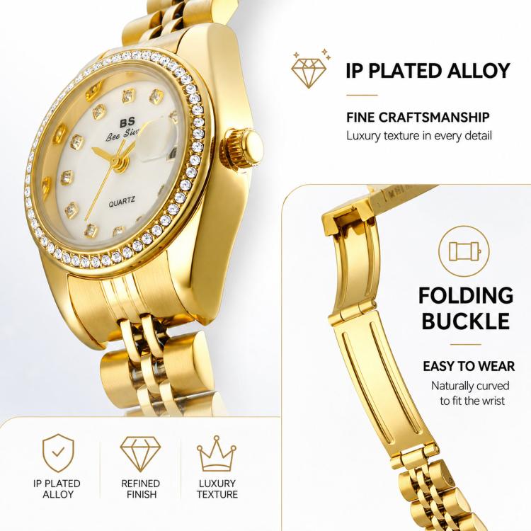 Gold-tone analog wristwatch close-up with rhinestone bezel and folding clasp
