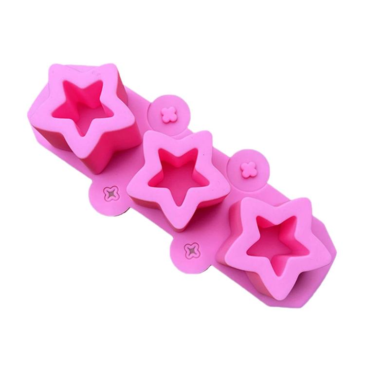 Pink silicone squishy mold bar with three star cavities and small flower accents
