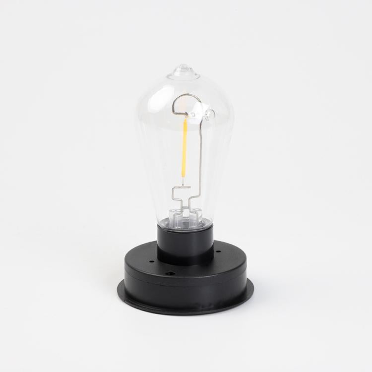 Clear bulb lamp inside black base for hanging solar lantern