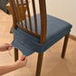 Dark gray textured dining chair seat cover with elastic hem and buckle tabs