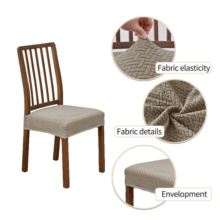 Gray seat cover with elastic fabric and woven details fitted on a dining chair