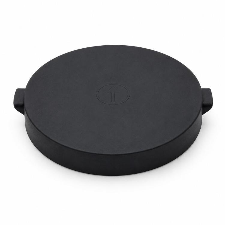 Round black silicone scale base protection cover with molded grip tabs, top view
