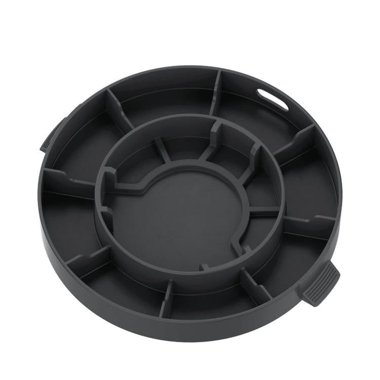 Black silicone weighing plate cover with molded underside channels and grip features