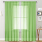 Green sheer voile curtain panel with rod pocket top for light filtering