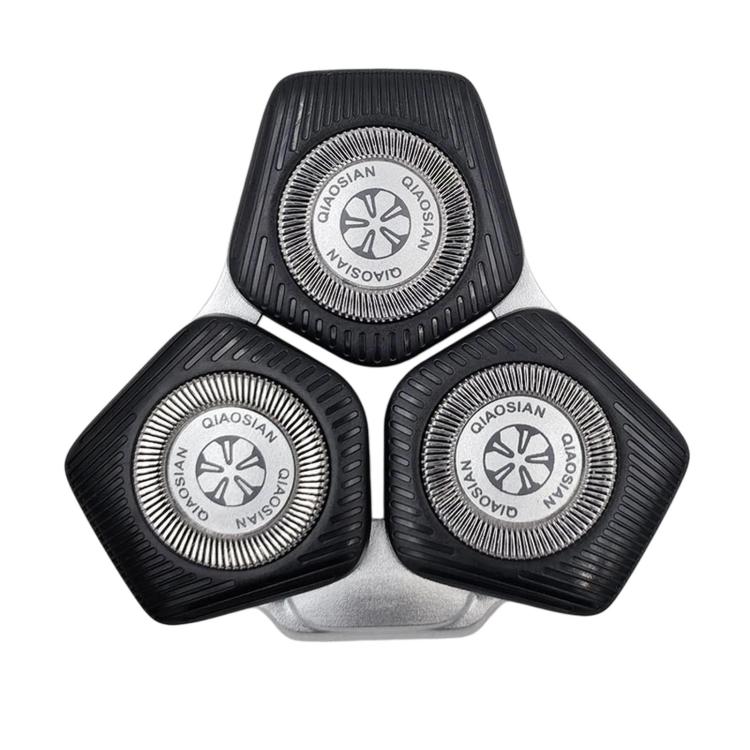 Black shaver replacement head with three circular foil trimmer blades and base tab.