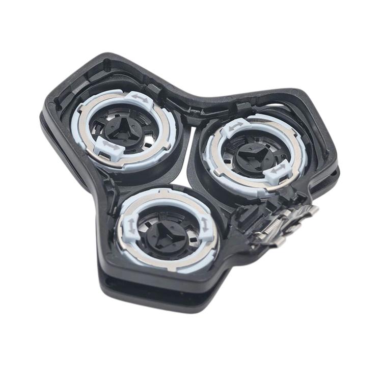Underside view of rotary shaver replacement head with three cutter mounts