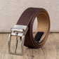 Brown belt detail: silver rotating pin buckle on woven strap