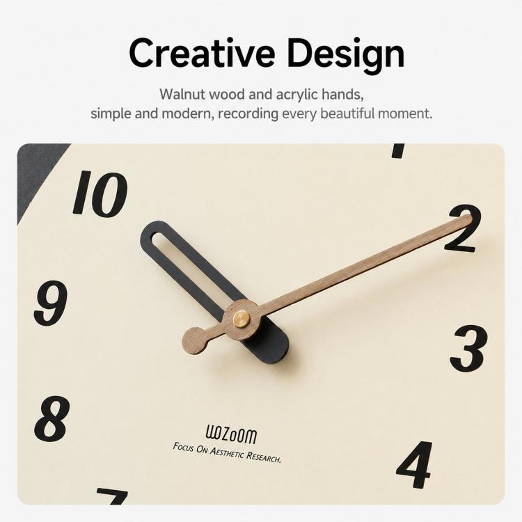 Clock dial close-up with walnut wood hands and numbered cream face