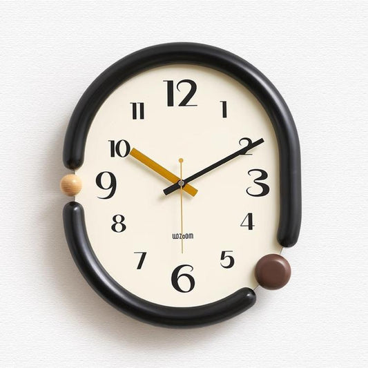 Retro oval wall clock, black frame with gold and black hands and brown side knob