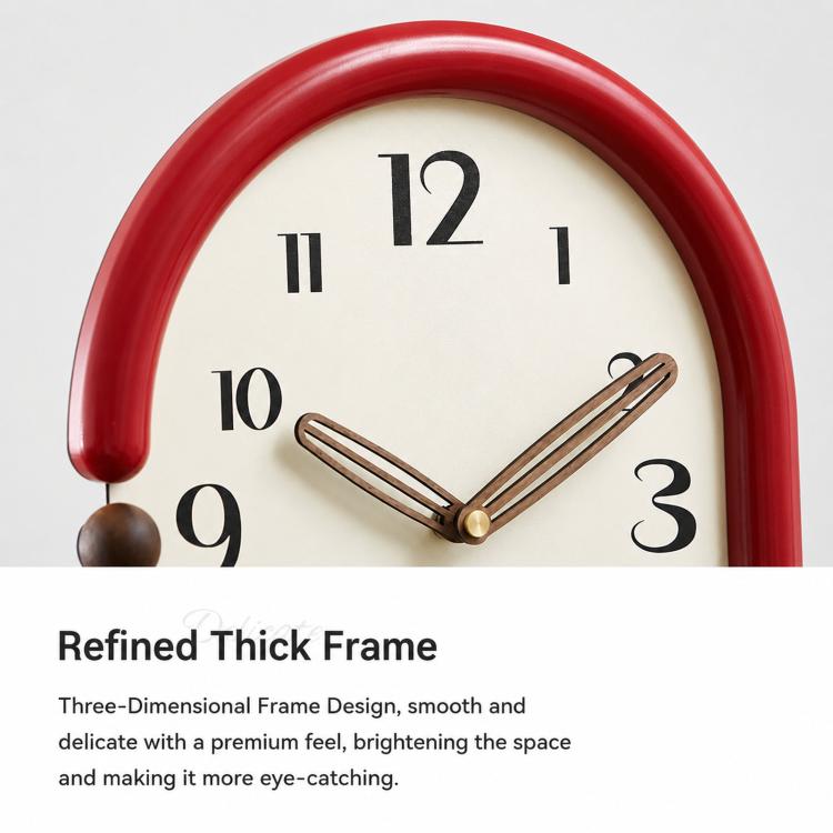 Retro oval wall clock with red frame, cream dial, striped hands and gold minute marks.