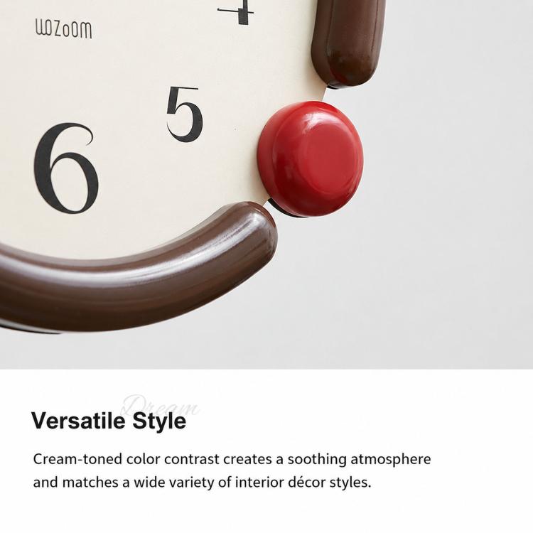 Retro oval wall clock detail showing brown curved frame and red knob on cream dial.