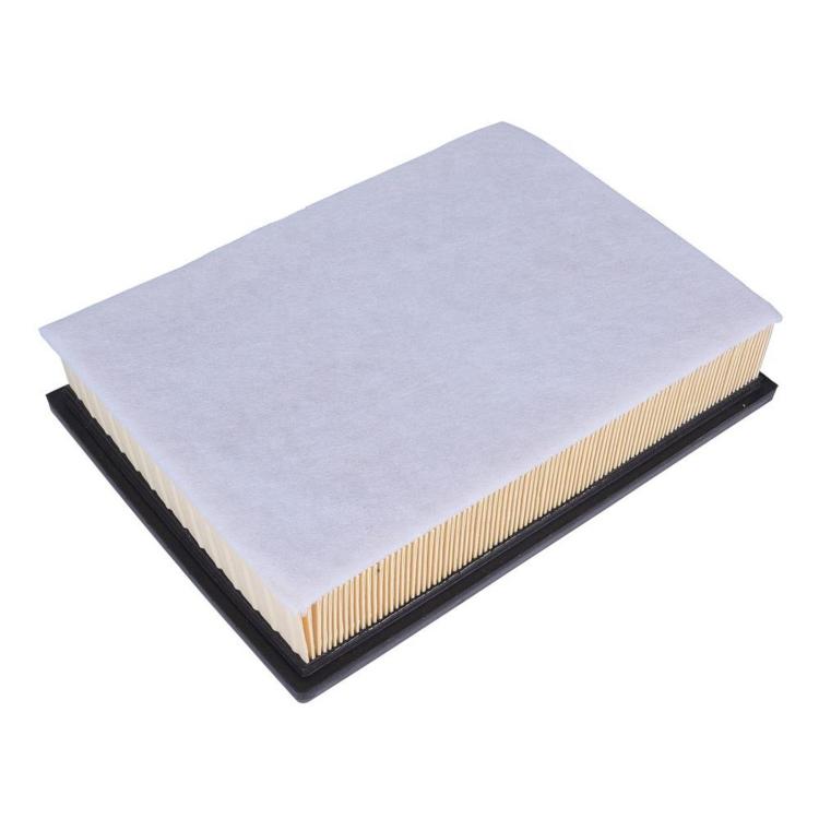 Car air filter with pleated paper under gray filter pad in black housing.