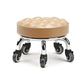 Low rolling stool with wheels, beige cushioned seat with quilted ridges