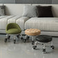 Low rolling stool with wheels, olive green upholstered seat and chrome caster base