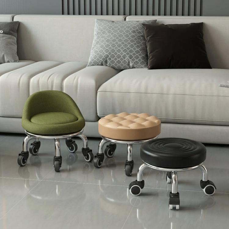 Low rolling stool with wheels, olive green upholstered seat and chrome caster base