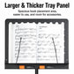 Portable folding music stand with black tray panel holding sheet music pages